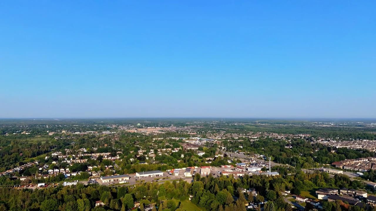 Aerial view of Oshawa, Ontario residential neighbourhoods under a clear blue sky.